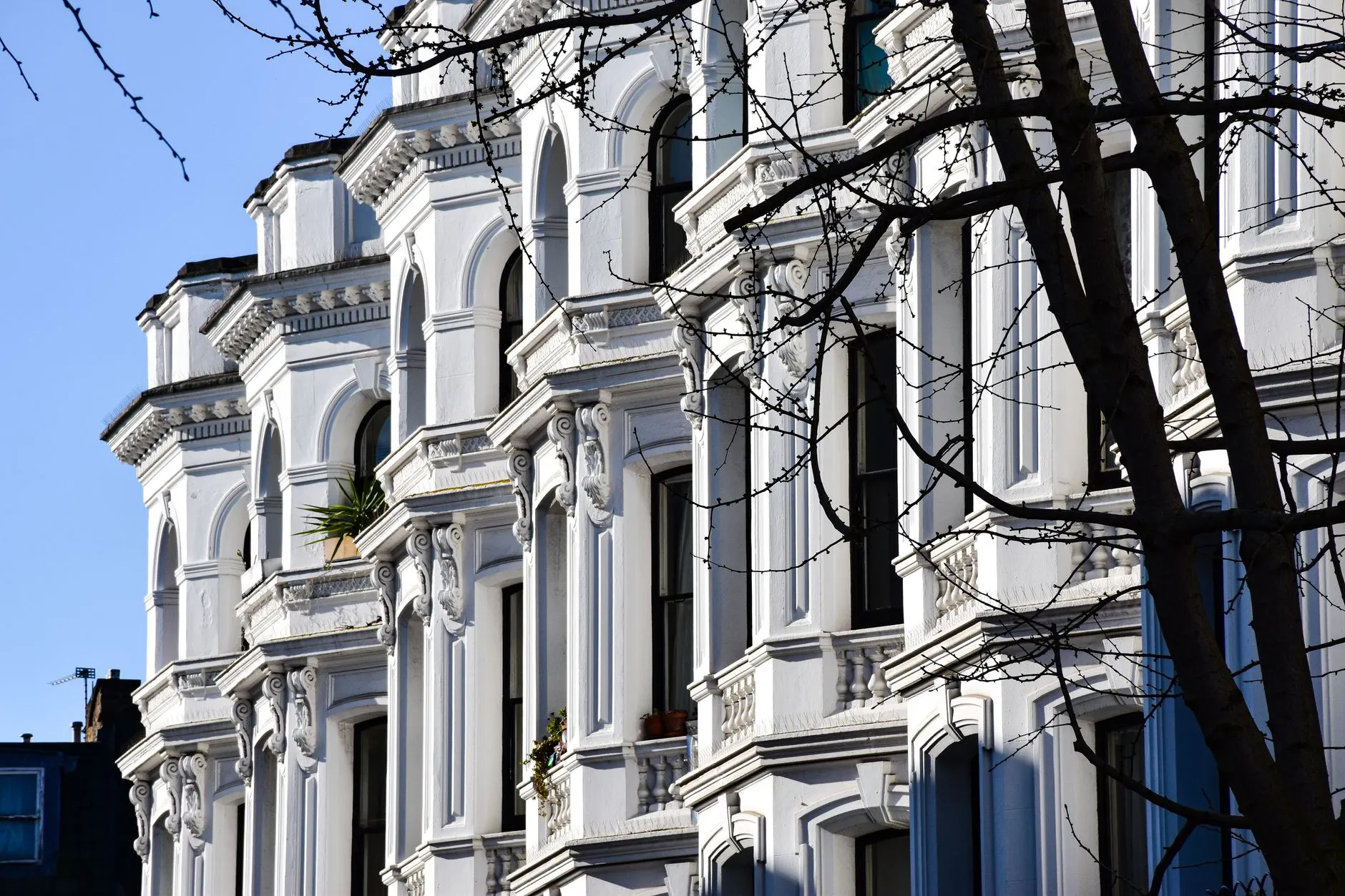 Beautiful Victorian row houses with ornamental details in London, UK.